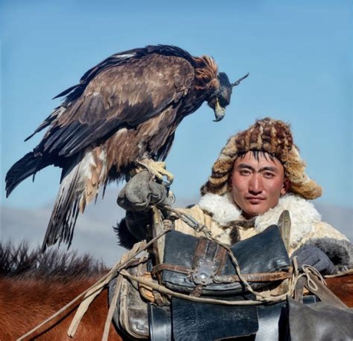 Mongolian Hunter Carrying His Eagle