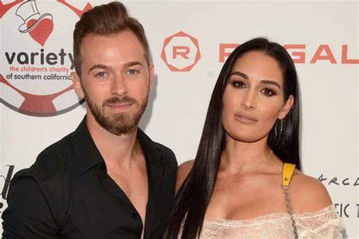 Nikki Bella and Artem Chigvintsev posing ahead of Dancing with the Stars Season 25