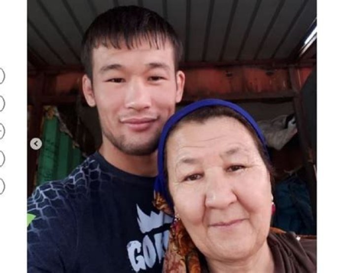 Shavkat Rakhmonov with his mother