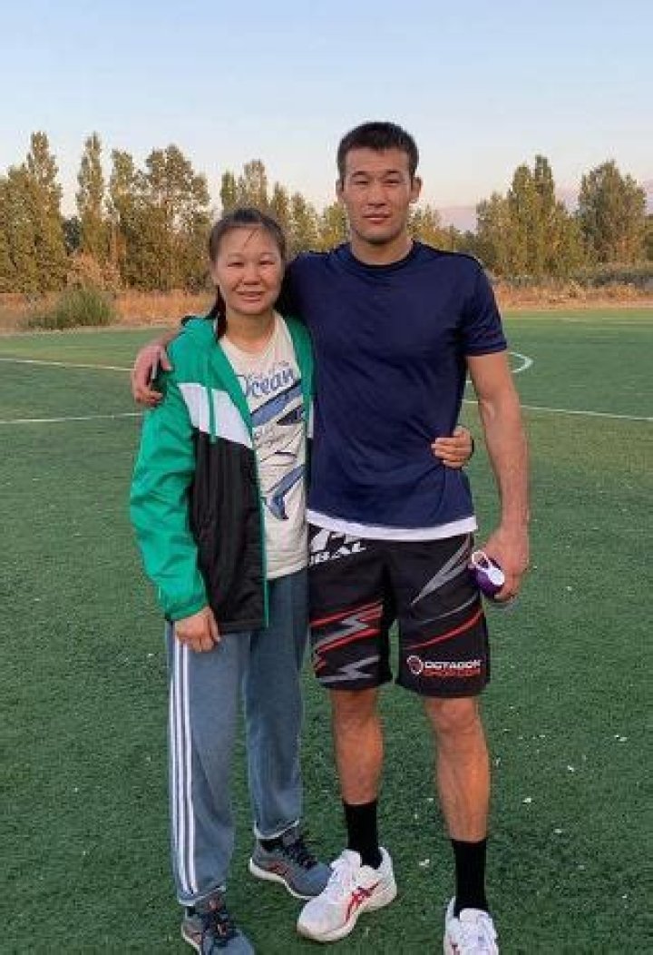 Shavkat Rakhmonov with his sister