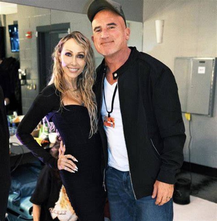 Tish Cyrus with her husband Dominic