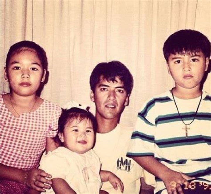 Young Danica with her dad and siblings